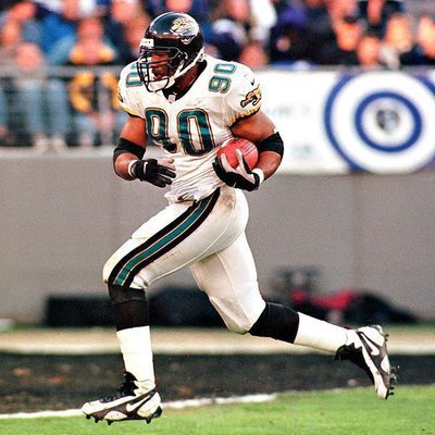 Image: Defensive End Tony Brackens, 90, scoring a defensive touchdown for the Jacksonville Jaguars.