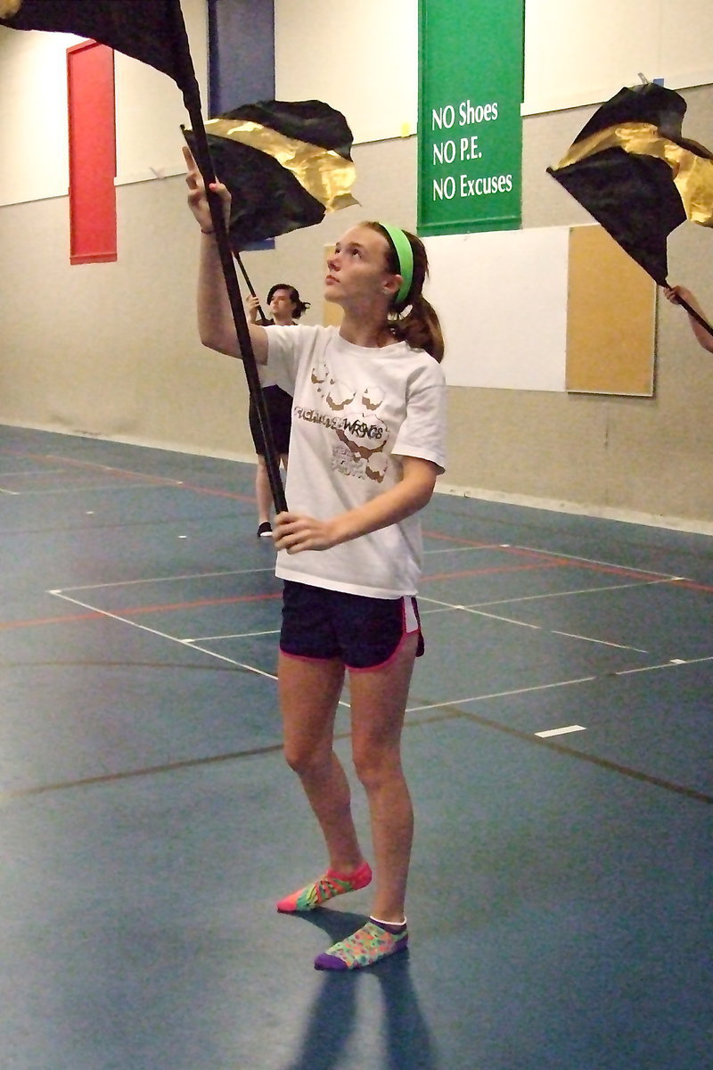 Image: Paige Cunningham waves her flag with the beat of the music.