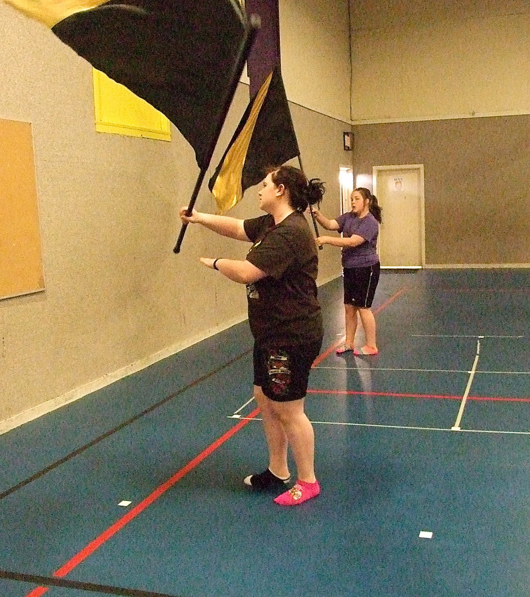 Image: Sarah Burrow and Kylee Dabney twirl and wave during a routine.