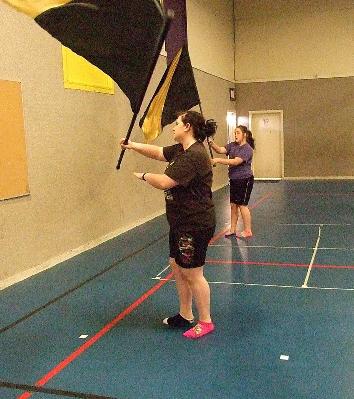 Image: Sarah Burrow and Kylee Dabney twirl and wave during a routine.