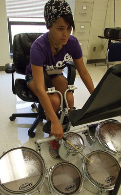 Image: Alex Minton makes playing the drums look easy.