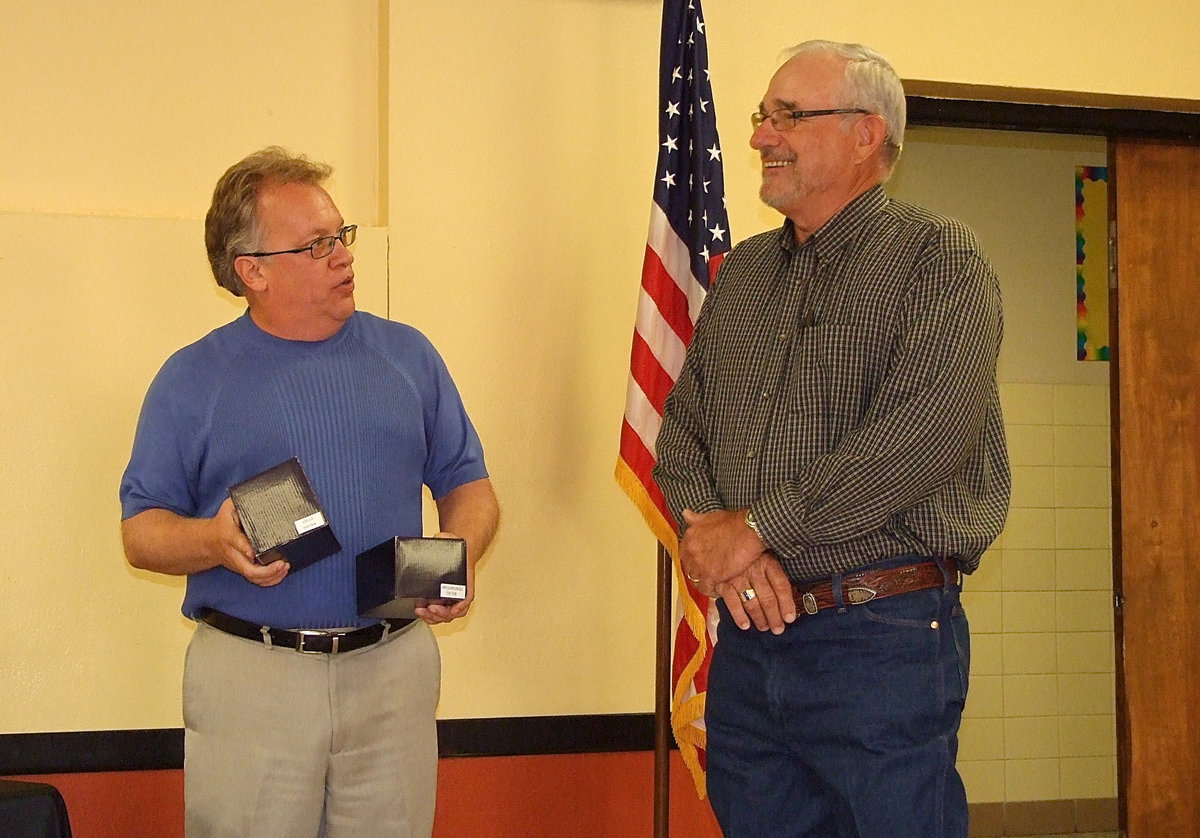 Image: Italy ISD superintendent Barry Bassett explains how Speed Hamby once commented, “What do I have to do to get a bobblehead?” Well, with his retirement, Hamby was presented two bobblehead dolls. A Tiger for all his hard work at Stafford Elementary and a Gladiator for his efforts at Italy High School as the district’s maintenance supervisor.