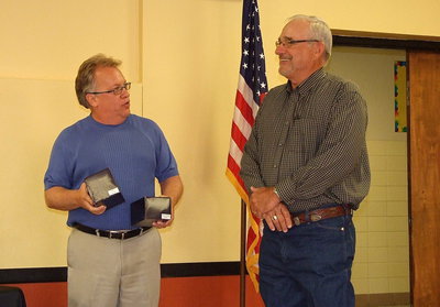 Image: Italy ISD superintendent Barry Bassett explains how Speed Hamby once commented, “What do I have to do to get a bobblehead?” Well, with his retirement, Hamby was presented two bobblehead dolls. A Tiger for all his hard work at Stafford Elementary and a Gladiator for his efforts at Italy High School as the district’s maintenance supervisor.