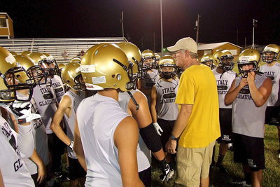 Image: Coach Tindol breaks his players after their Midnight Madness workout on Willis Field.