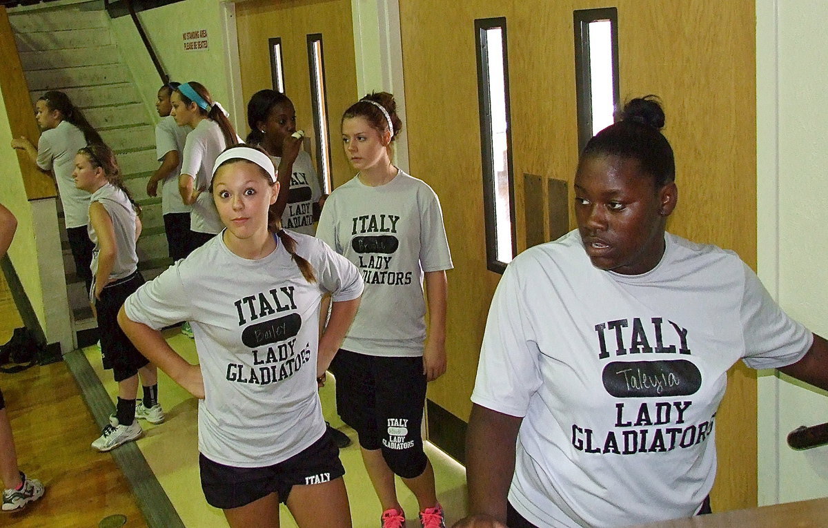 Image: Bailey Eubank (jr.), Brook DeBorde (fr.) and Taleyia Wilson (so.) prepare to run stairs inside the double-decked Italy Coliseum.