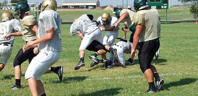 Image: Coby Bland makes a violent tackle on an Eagle running back with Valley Mills searching for yards up the gut.