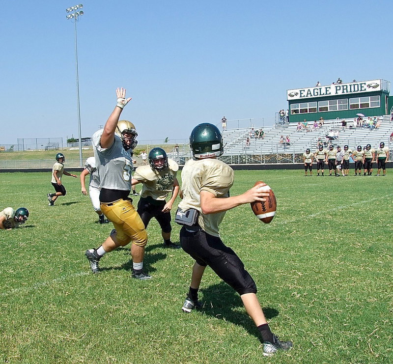 Image: Italy’s Kevin Roldan(50) pressures the Valley Mills quarterback and tips the pass attempt to force an incomplete pass.