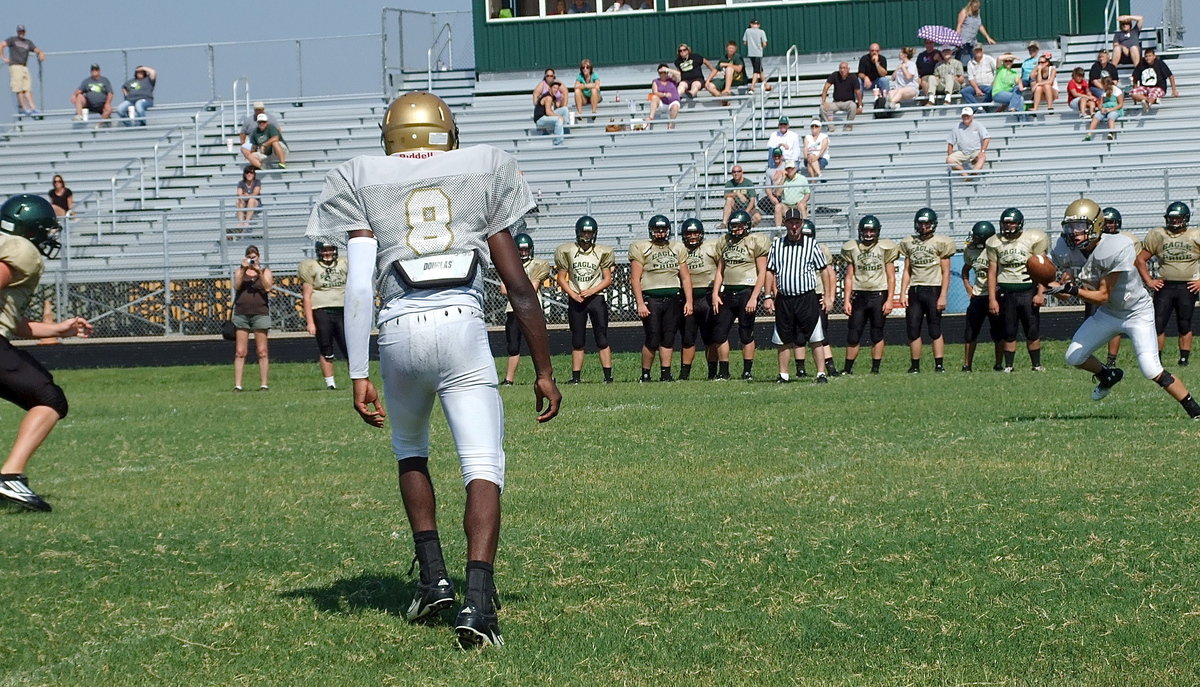 Image: Sophomore receiver, Ryan Connor(2), soft hands a pass from quarterback Tamarcus Sheppard(8) and then turns upfield for a gain of 6-yards for the Gladiators.