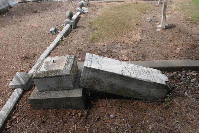 Image: The tombstone of Oliver T. Loyd was vandalized in Section 6 of the cemetery. Loyd was born in 1879 and died in 1899.