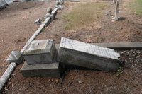 Image: The tombstone of Oliver T. Loyd was vandalized in Section 6 of the cemetery. Loyd was born in 1879 and died in 1899.
