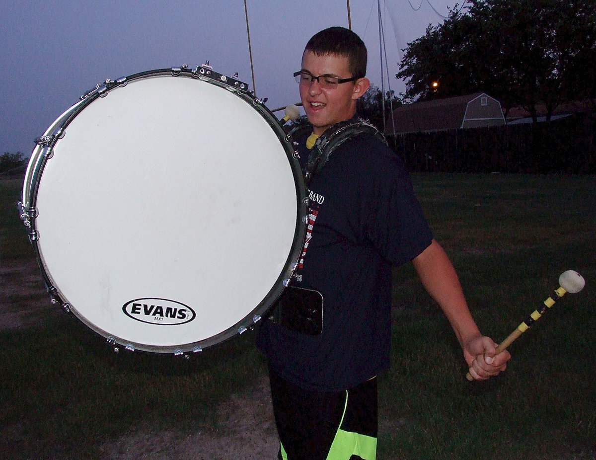 Image: Austin Crawford pounds out sounds of war as the Gladiator Regiment Marching Band displays their 2013 battle formations and theme entitled, “The War Between The States.”