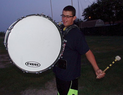 Image: Austin Crawford pounds out sounds of war as the Gladiator Regiment Marching Band displays their 2013 battle formations and theme entitled, “The War Between The States.”