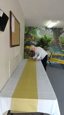 Image: Linda Erwin prepares for the luncheon.