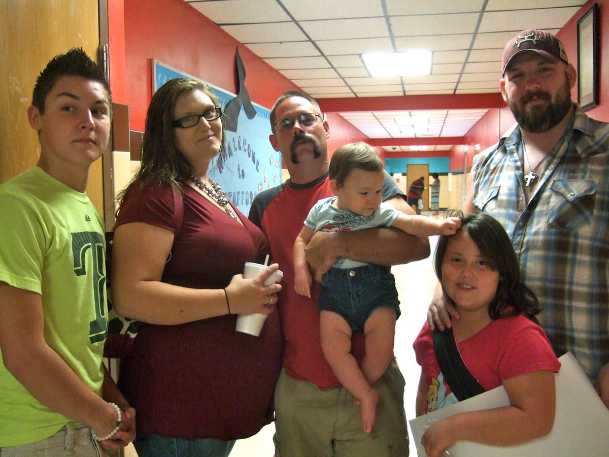 Image: Colton Grant, Chelsie Kimmons, Chris Kimmons, Brayden Kimmons, Dixie Brady and Thomas Brady come to gather at “Meet the Teacher Night.”