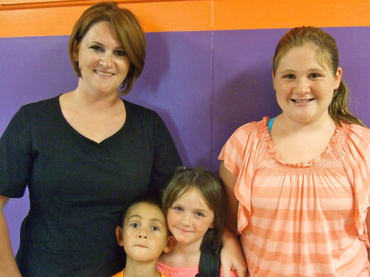 Image: Chrissy Guerrero, Raegan Jones, George Guerrero and Chole Jones are ready for school to start.