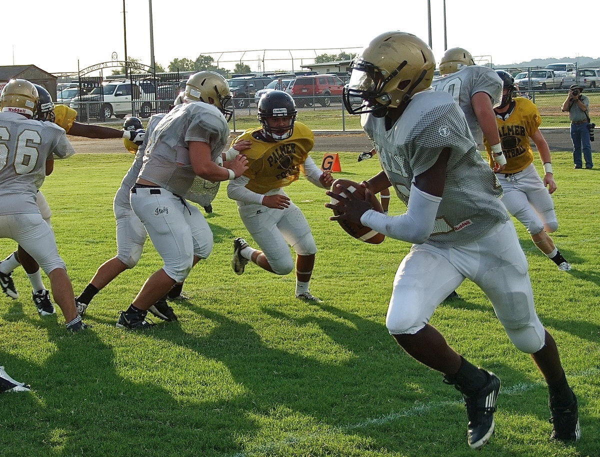 Image: Rolling out is Italy senior QB Tamarcus Sheppard behind blocks from Cody Medrano(66), Kyle Fortenbrry(75), Zain Byers(60) and Kevin Roldan(50).