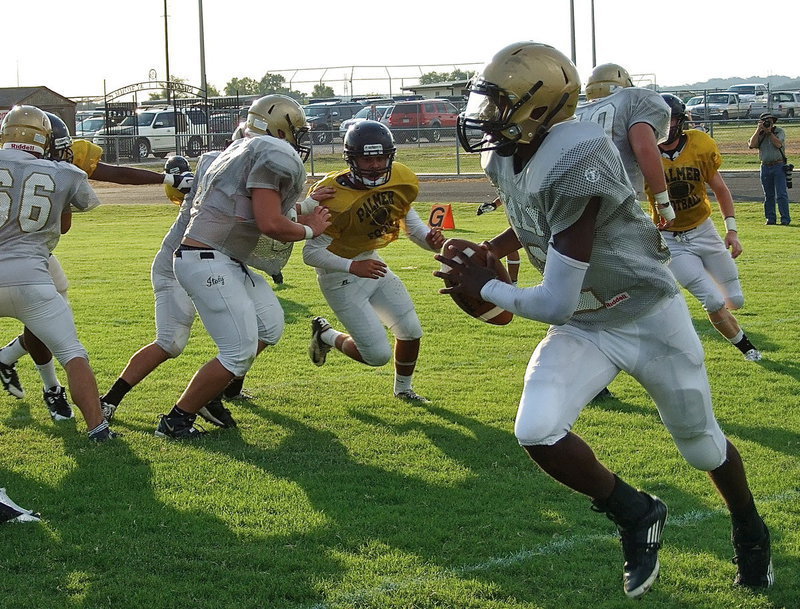 Image: Rolling out is Italy senior QB Tamarcus Sheppard behind blocks from Cody Medrano(66), Kyle Fortenbrry(75), Zain Byers(60) and Kevin Roldan(50).