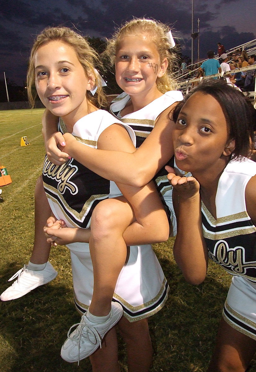 Image: Italy JH cheerleaders Hannah Haight, Karson Holley and Keondra Jackson ham it up for the camera.