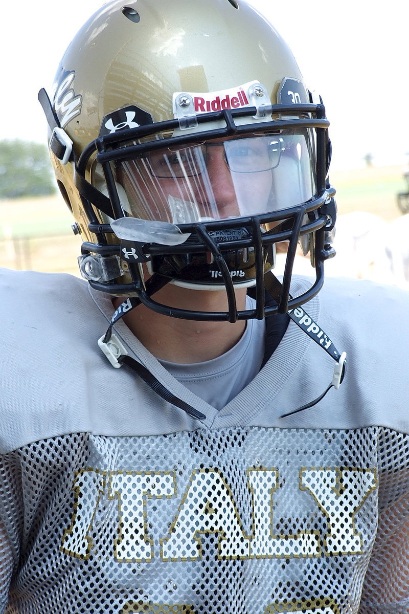 Image: JV Gladiator Hunter Ballard is protected by his shield.