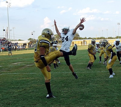 Image: David De La Hoya(60) gets the punt away despite a Malakoff defender getting a piece of the ball.