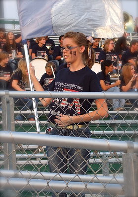 Image: Italy Color Guard captain Anna Riddle practices her flag movements as fans settle in for the big game.