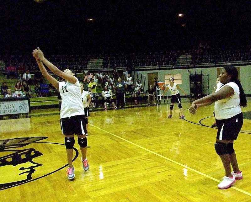 Image: Italy bumps the ball back over the net.