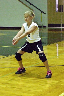 Image: Italy’s Karson Holley(3) gets into her defensive position and concentrates on the upcoming serve.