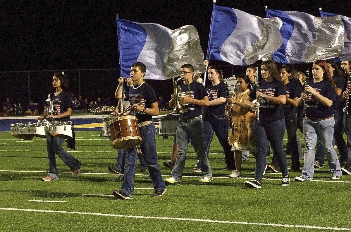 Image: Blake Brewer leads the Gladiator Regiment Band on to the field.