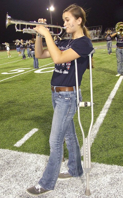 Image: Amber Hooker was injured in a volleyball game but that couldn’t stop her Friday night.