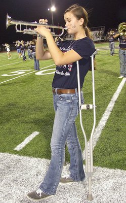 Image: Amber Hooker was injured in a volleyball game but that couldn’t stop her Friday night.