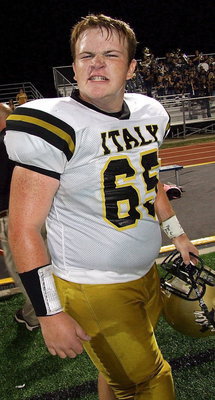 Image: Tyler Vencill(65) is game faced up for the second half.