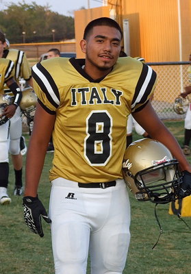 Image: Ray Salas(8) goes into battle against the Sunnyvale Raiders.