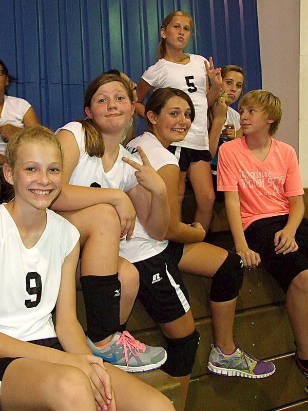 Image: Italy 7th graders Taylor Boyd, Tatum Adams, Cassidy Gage, Karson Holley and Hannah Haight mingle in the bleachers after their win over Milford.