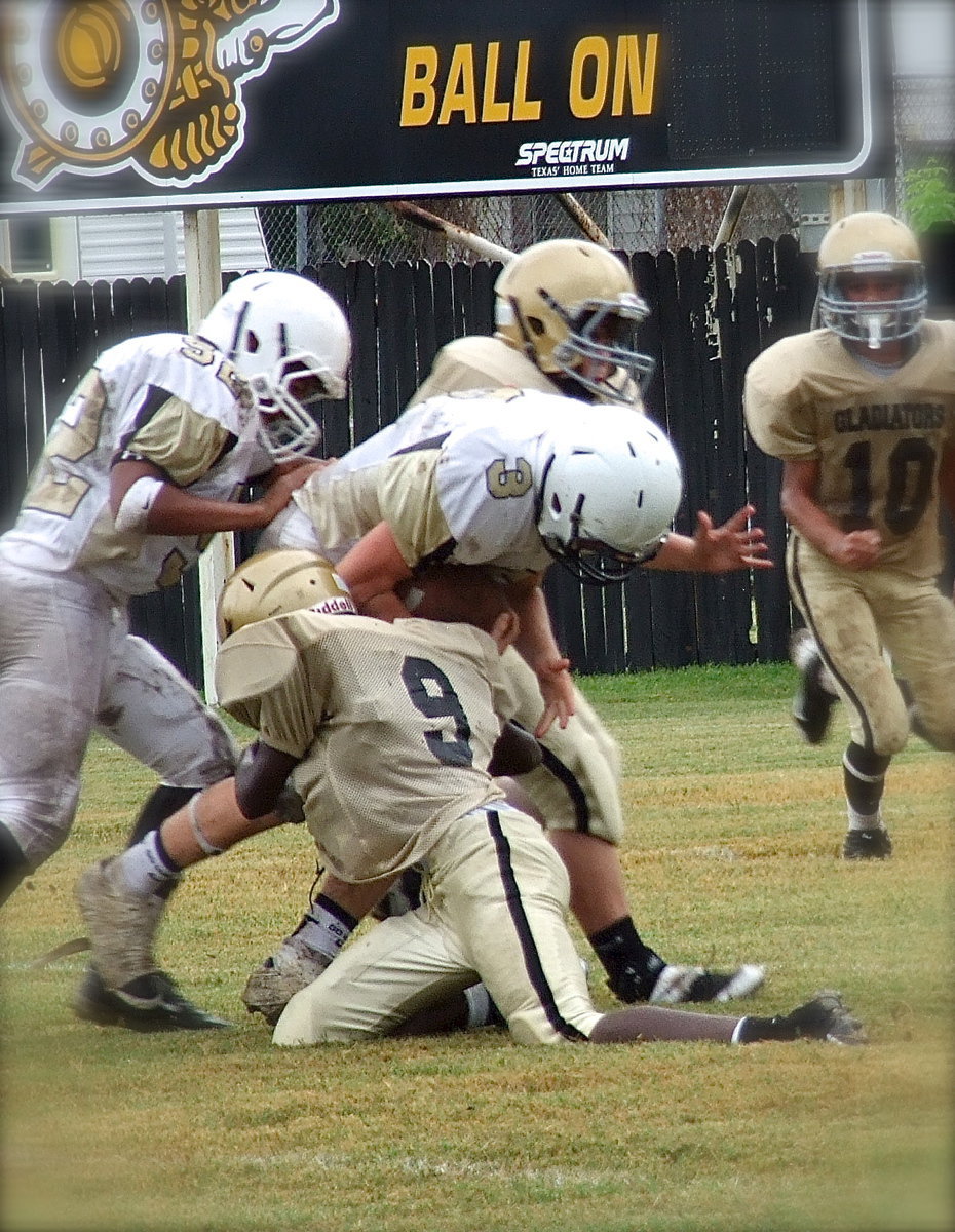 Image: Low man wins: Chasston Wilson(9) lowers his pad level to make the tackle on a Jaguar runner.
