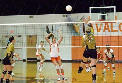 Image: Lady Gladiator Jaclynn Lewis(13) goes for the point.