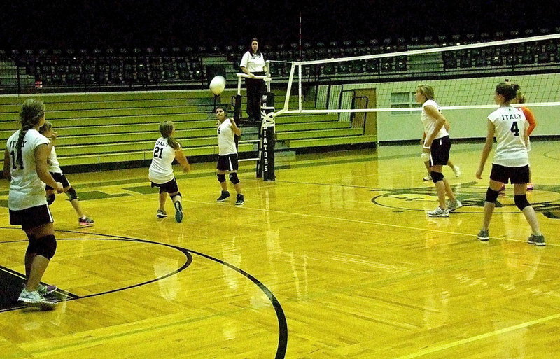 Image: Tatum Adams(21) reaches the ball in time to fire back a counter shot.