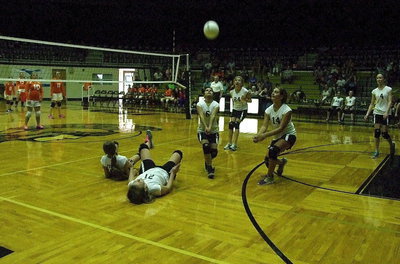 Image: Effort wins games. After Karley Nelson(8) and Tatum Adams(21) collide, Juliette Salazar(6) hustles over to keep the volley going.