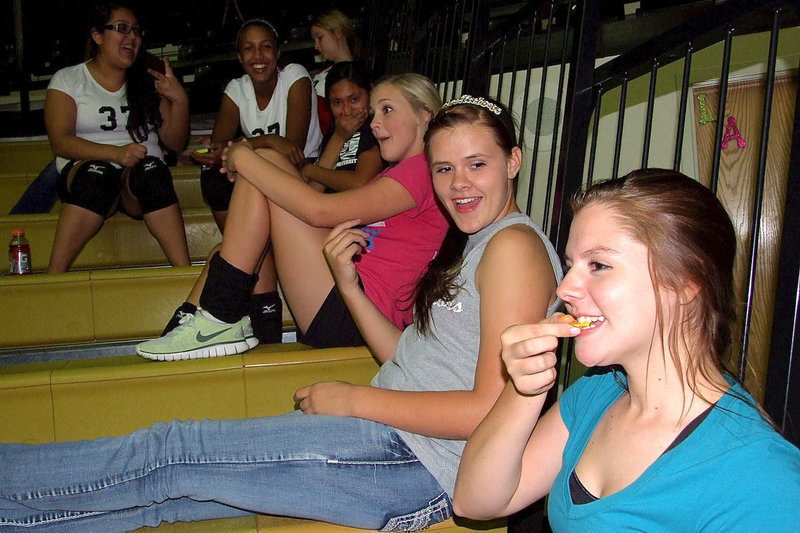Image: Brooke DeBorde (on nacho), Lillie Perry, Annie Perry, Marlen Hernandez, Emmy Cunningham, Lorena Rodriguez and Rachel Huskins have a little funny while watching the game.