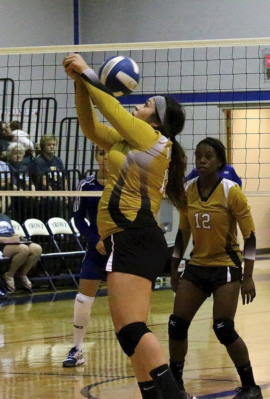 Image: Monserrat Figueroa(15) bumps the ball over to teammate Kortnei Johnson(12).