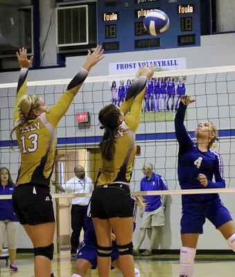 Image: Italy’s Jaclynn Lewis(13) and Bailey Eubank(1) go for the block above the net against Frost.