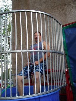 Image: Milford Police Chief Carlos Phoenix is quite a sport taking his turn in the dunking booth.