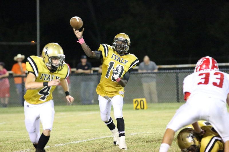 Image: TaMarcus Sheppard(10) flings a pass into the flat with Justin Wood(4) ensuring Sheppard’s safety.