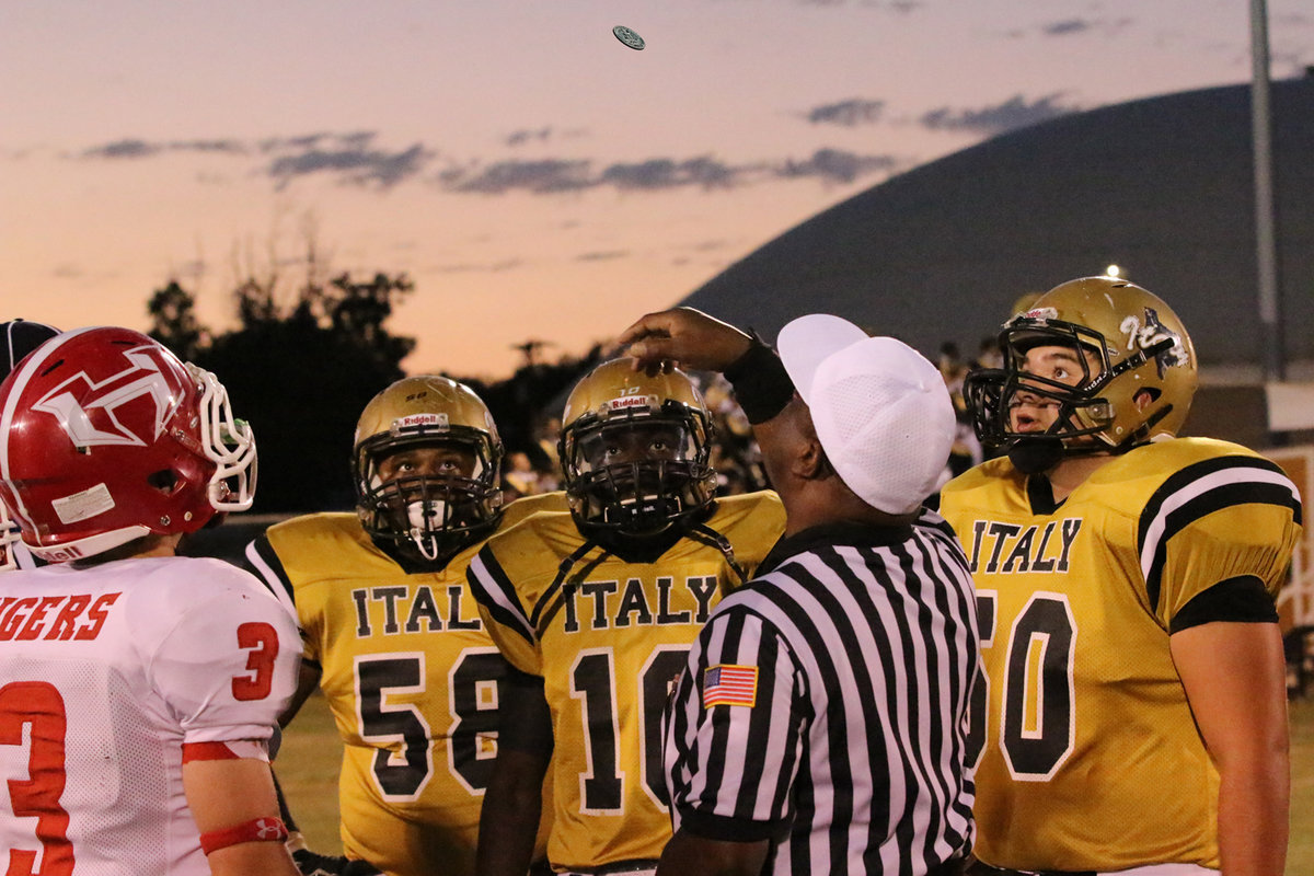 Image: Gladiator senior captains Darol Mayberry(58), TaMarcus Sheppard(10) and Kevin Roldan(60) are eager for the results of the coin toss with the Hico Tigers in town.