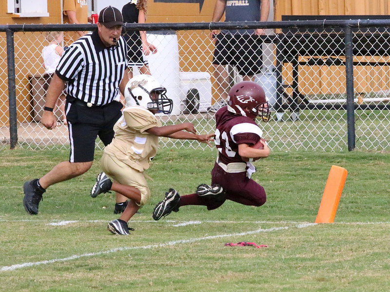 Image: The Eagles soar into the endzone despite a great defensive effort from Italy safety Curtis Benson(1). The Eagles went up 19-7 on the play.