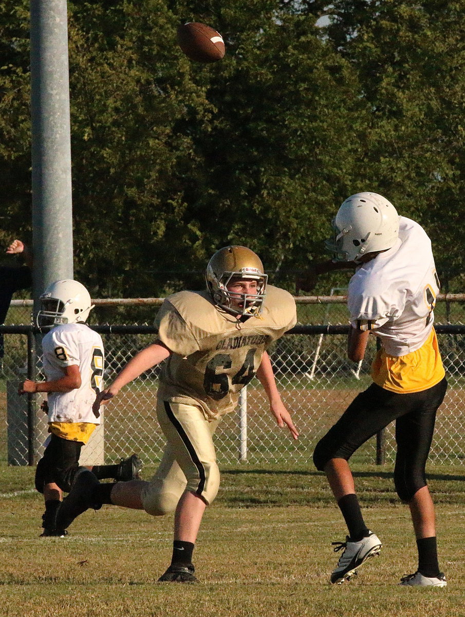 Image: Hunter Morgan(64) hurries Itasca’s quarterback to force an incomplete pass.