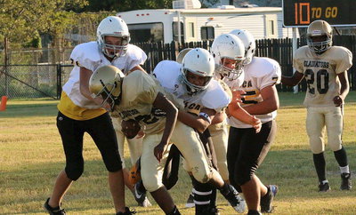 Image: …Linebacker Anthony Lusk(72) intercepts the pass and then gets attacked by the Cats.