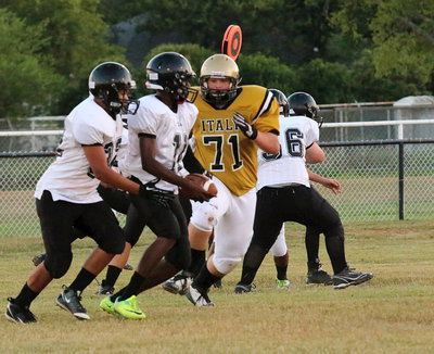 Image: Italy defensive tackle Aaron Pittmon(71) tackles the entire Wampus Cat backfield.