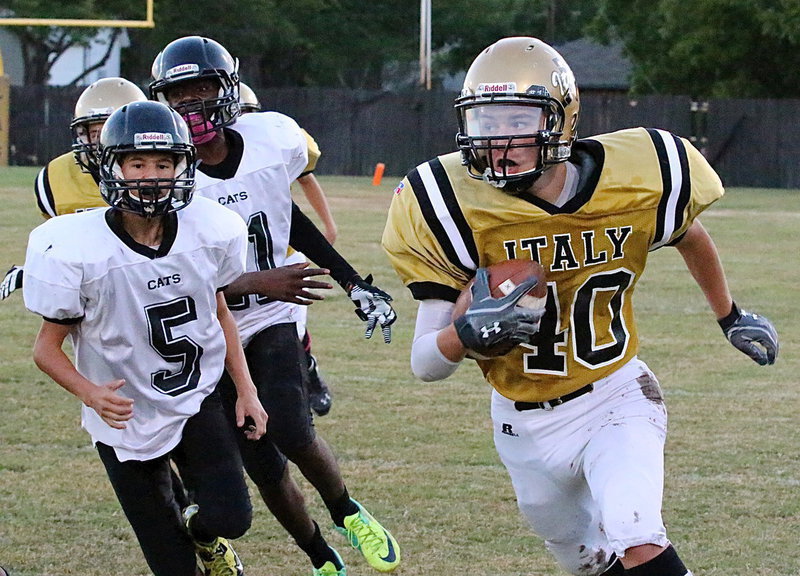Image: Sparking Italy’s JV offense is Colton Grant(40) who gets the edge and then motors down Italy’s sideline.