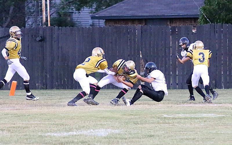 Image: Dylan McCasland(3), blocks his man as quarterback, Joe Celis(2), gives his running back, Eli Garcia(32), a nudge into the endzone, putting Italy on the board first, 6-0.