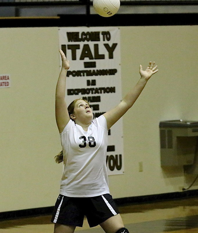 Image: Reagan Jones(38) serves with all her might over to Frost.